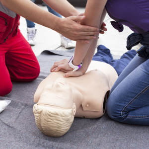 People performing CPR on manikin